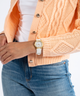 GUESS Ladies Gold Tone Analog Watch Box Set lifestyle orange sweater and white watch
