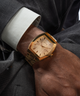 GUESS Mens Gold Tone Analog Watch lifestyle watch on arm