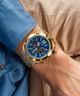 GUESS Mens Gold Tone Multi-function Watch lifestyle watch on arm