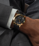 GW0728G2 GUESS Mens Black Gold Tone Analog Watch lifestyle watch on wrist
