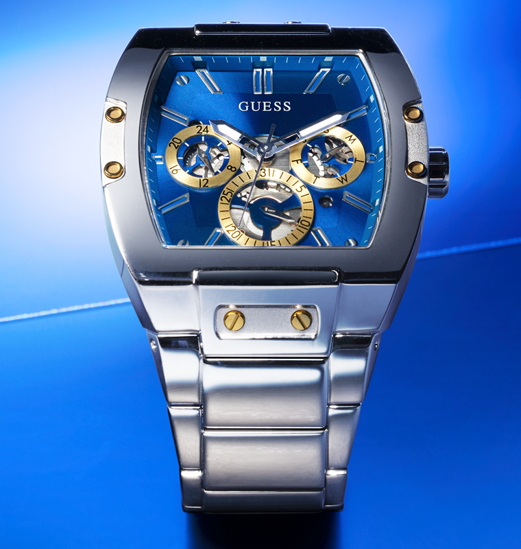 silver watch with blue dial on blue background