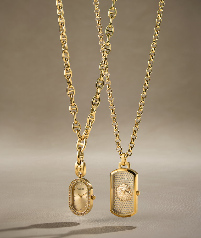 two gold GUES watch pendants