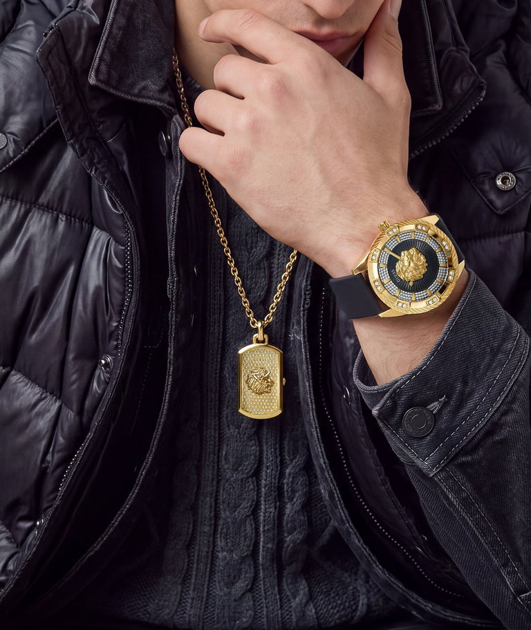 man wearing lion head watch pendant and gold watch