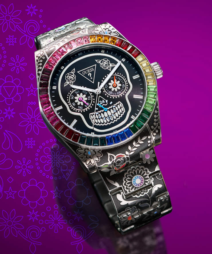 Colorful skull-themed watch with gemstones on a purple floral background