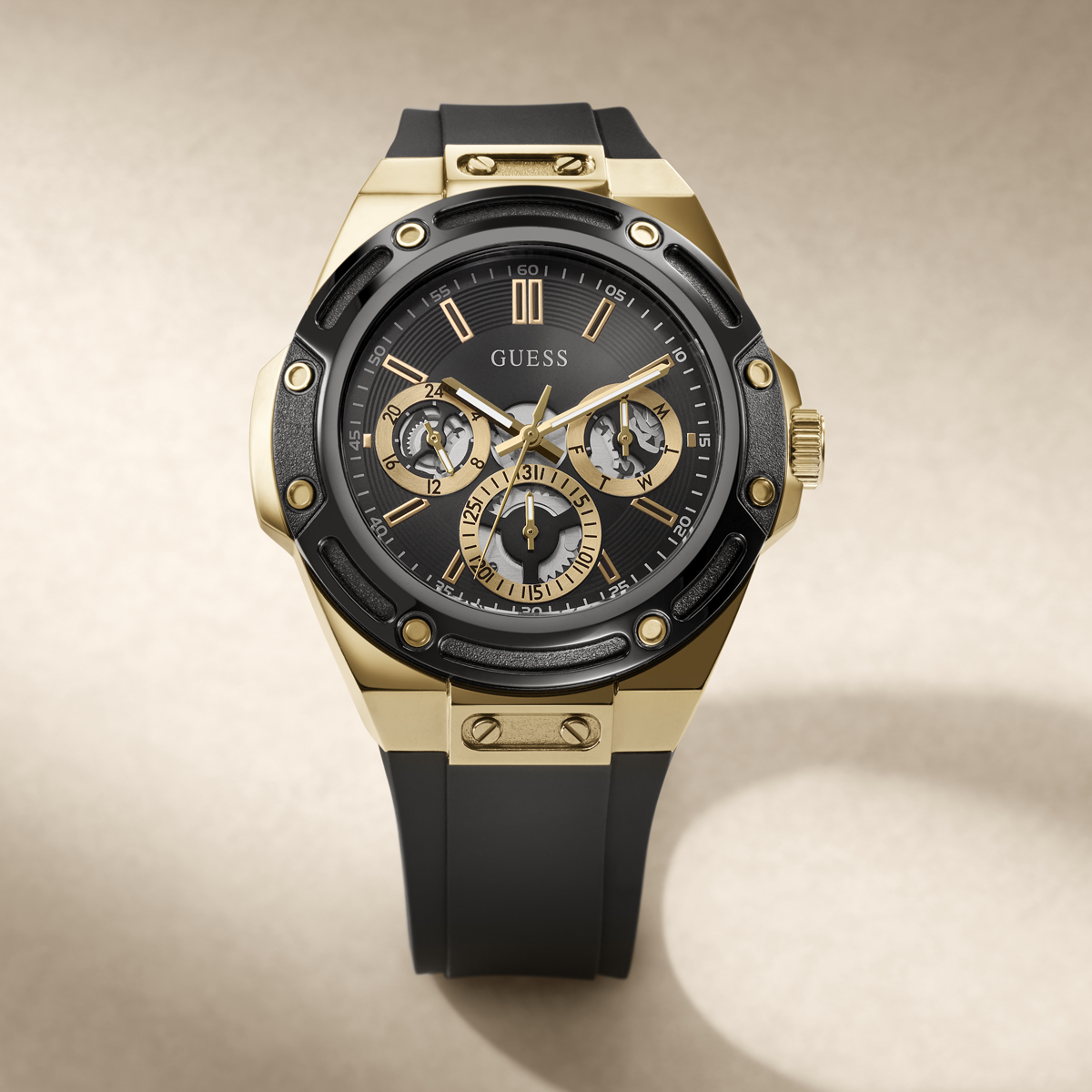 https://guesswatches.com/products/guess-mens-carver-black-gold-tone-multi-function-watch-gw1132g2