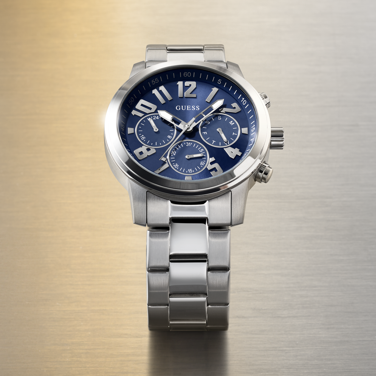 Silver watch with a blue face on a gradient background