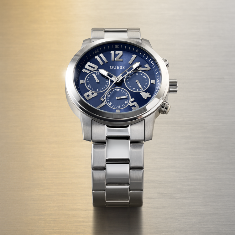 Silver watch with a blue face on a gradient background