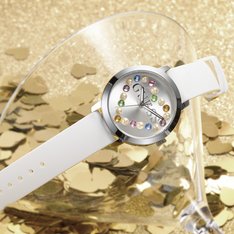 Guess watch with white silicone strap and dial with multi color stones in the shape of a heart