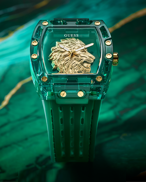 Green watch with gold lion emblem and 'Guess' branding on a green background gw0959g2