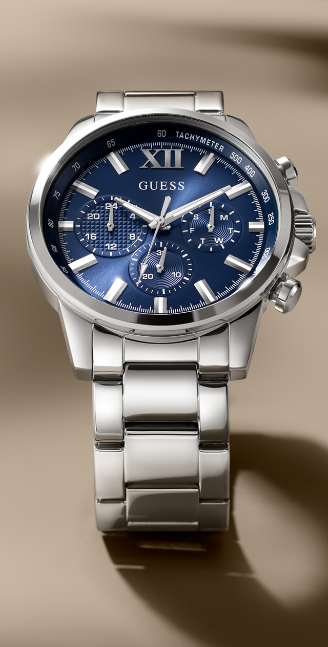Silver watch GW0900G4 with a blue face on a beige background
