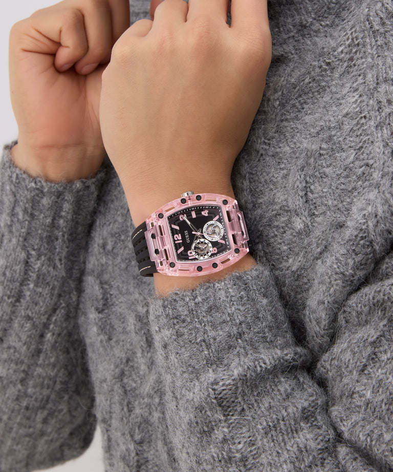 GUESS Mens Sporting Pink Multi-function Watch on a person's wrist with a gray sweater