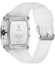 The back view of a GUESS watch with a transparent crystal case, a white silicone strap with pink stitching, and a silver buckle.