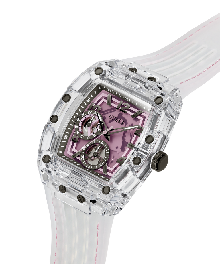 A luxury watch by GUESS featuring a transparent clear resin case, a white rubber strap with pink stitching, and a pink patterned dial with black details. lifestyle