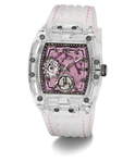 A Guess wristwatch with a transparent clear resin case, a pink skeleton dial, and a white silicone strap with pink stitching, shown on a white background.