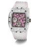 A Guess wristwatch with a transparent clear resin case, a pink skeleton dial, and a white silicone strap with pink stitching, shown on a white background.