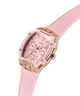 GUESS Ladies Sparkling Pink Rose Gold Tone Multi-function Watch with rose gold accents on a white background lifestyle