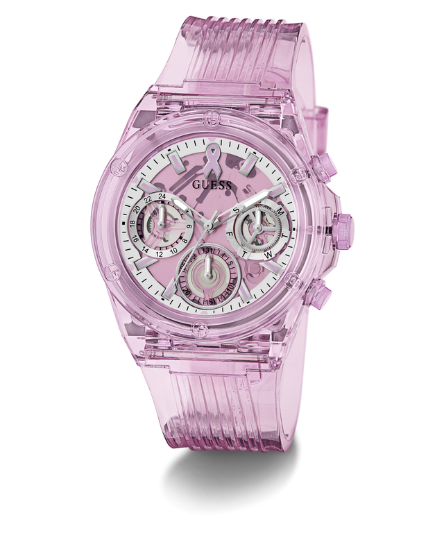 A translucent pink GUESS watch with a matching pink ribbed strap and a white dial featuring multiple subdials.
