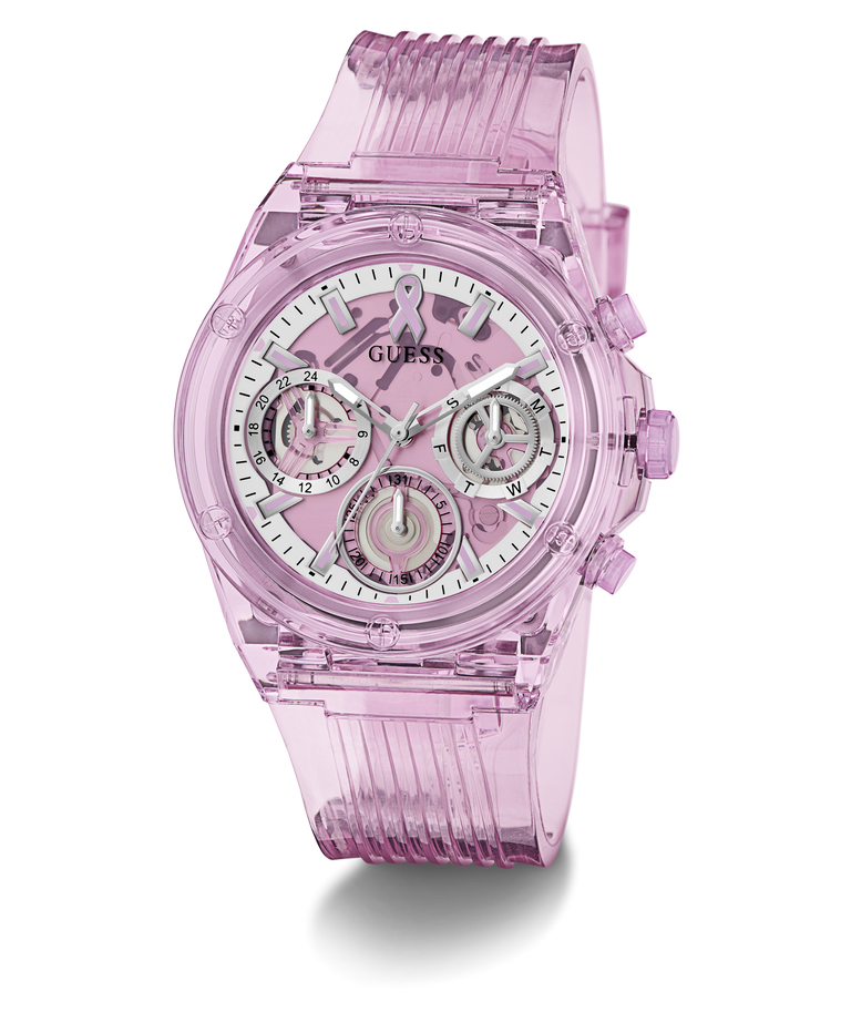 A translucent pink GUESS watch with a matching pink ribbed strap and a white dial featuring multiple subdials.