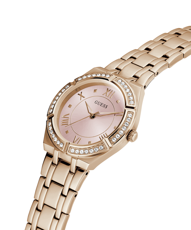 Rose gold watch with a pink face on a white background lifestyle