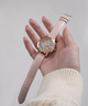 GW0383L2 GUESS Ladies Pink & Rose Gold Tone Analog Watch lifestyle hand holding watch