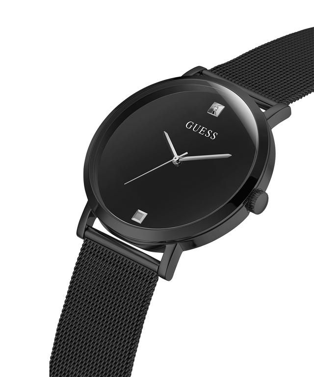 Black Guess watch with mesh band on a white background lifestyle