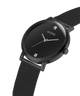 Black Guess watch with mesh band on a white background lifestyle