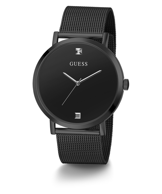 Black Guess watch with mesh band on a white background