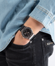 GUESS Mens Black Silver Tone Multi-function Watch lifestyle hand in pocket with watch on