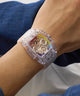 Clear GUESS Mens Pride Limited Edition Clear Analog Watch with colorful face on a wrist against a neutral background