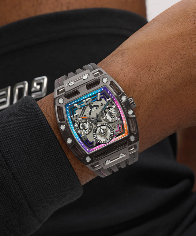 GUESS Mens Black Multifunction Watch with intricate design on a person's wrist, brand name visible