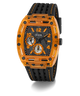 A GUESS men's watch featuring a transparent orange case and a black textured strap with orange stitching, set against a plain white background.