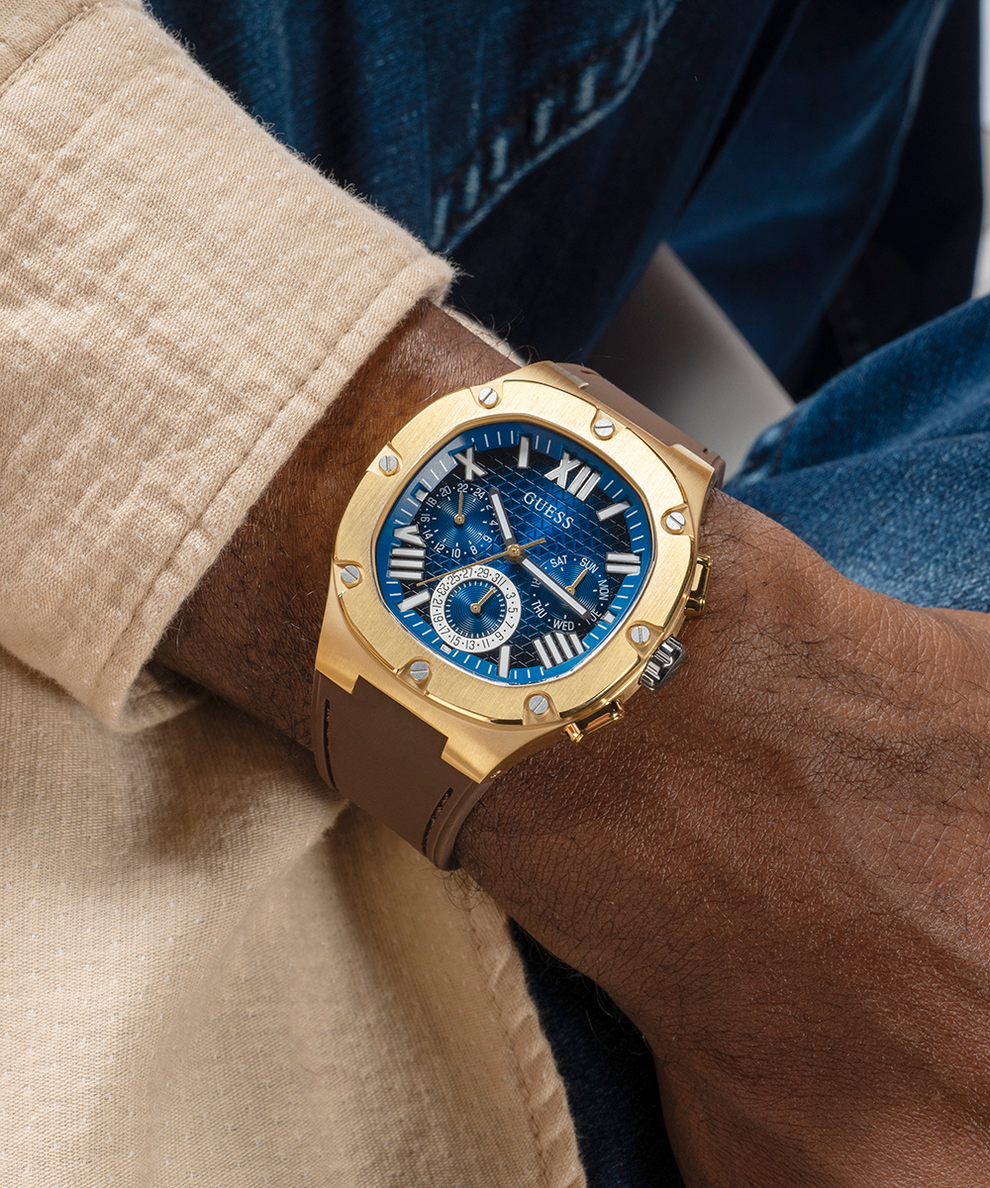 GUESS Mens Brown Gold Tone Multi-function Watch lifestyle watch with blue dial on wrist