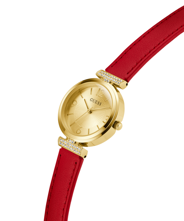 GUESS Ladies Red Gold Tone Analog Watch with a red strap on a white background lifestyle