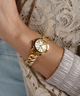 GUESS Ladies Gold Tone Analog Watch lifestyle watch on wrist