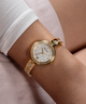 GUESS Ladies Gold Tone Analog Watch lifestyle watch on arm