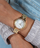 GUESS Ladies Gold Tone Date Watch lifestyle watch on wrist