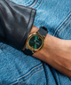 GUESS Ladies Black Gold Tone Analog Watch lifestyle watch on wrist