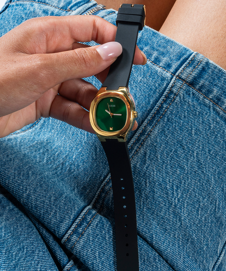 GUESS Ladies Black Gold Tone Analog Watch lifestyle hand holding watch