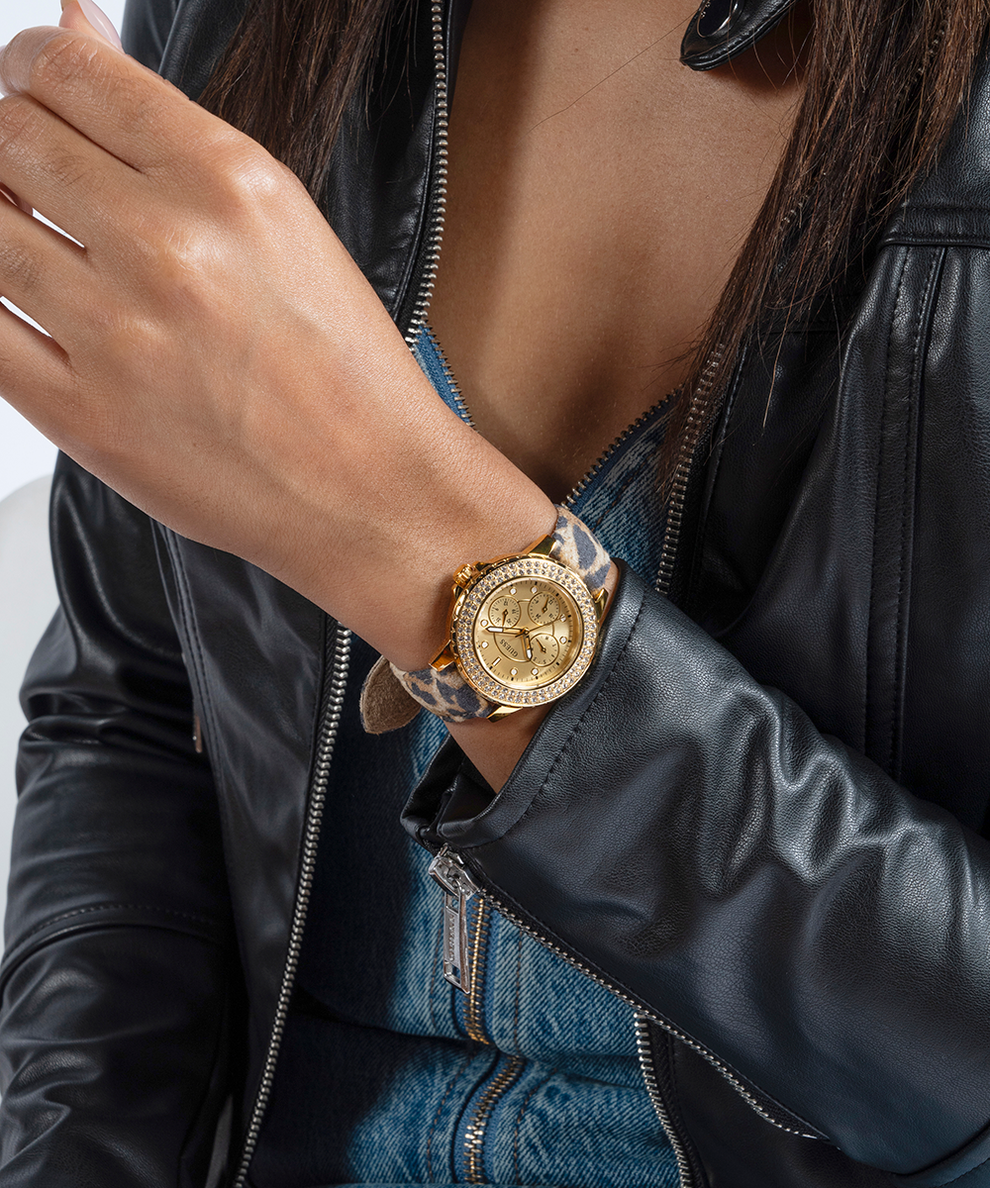 gold and animal strap watch on wrist lifestyle