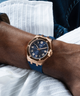 GUESS Mens Blue Rose Gold Tone Analog Watch lifestyle blue dial watch on wrist