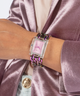 GUESS Ladies Iridescent Clear Analog Watch lifestyle watch on wrist with purple jacket