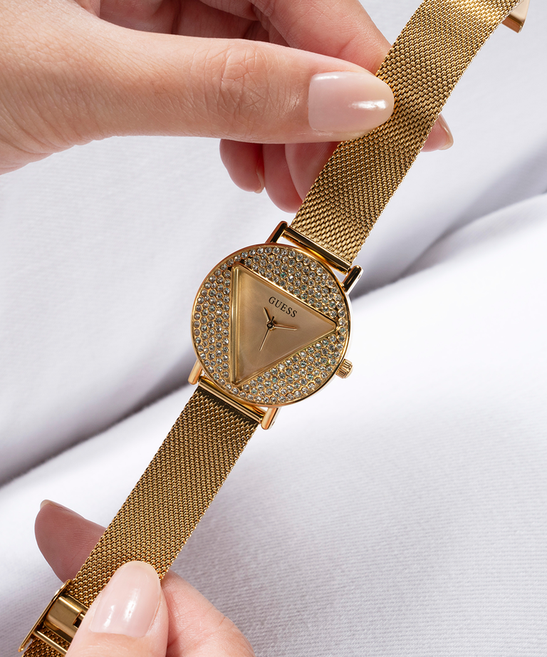 GUESS Ladies Gold Tone Analog Watch lifestyle hand holding watch
