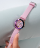 GW0678L3 GUESS Ladies Pink Iridescent Analog Watch lifestyle hand holding watch
