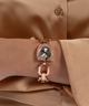 GUESS Ladies Rose Gold Tone Analog Watch lifestyle watch on arm brown shirt