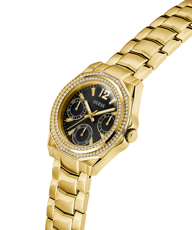 Gold watch with black dial on a white background lifestyle