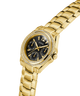 Gold watch with black dial on a white background lifestyle