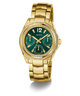 GUESS Ladies Gold Tone Multi-function Watch with a green face and diamond-studded bezel on a white background