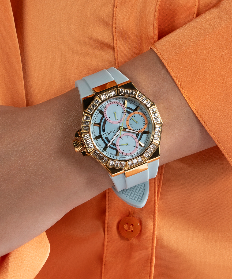GUESS Ladies Blue Gold Tone Multi-function Watch lifestyle watch on arm orange shirt