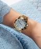 GUESS Ladies Gold Tone Multi-function Watch lifestyle watch on arm