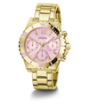 A gold-tone stainless steel wristwatch with a pink sunburst dial, featuring three subdials, gold-tone hour markers, and a matching gold-tone metal link bracelet. The brand name 'GUESS' is printed on the dial.
